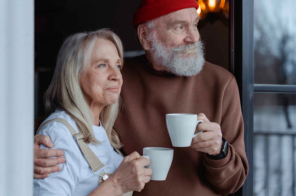 Senior man and woman talking over coffee