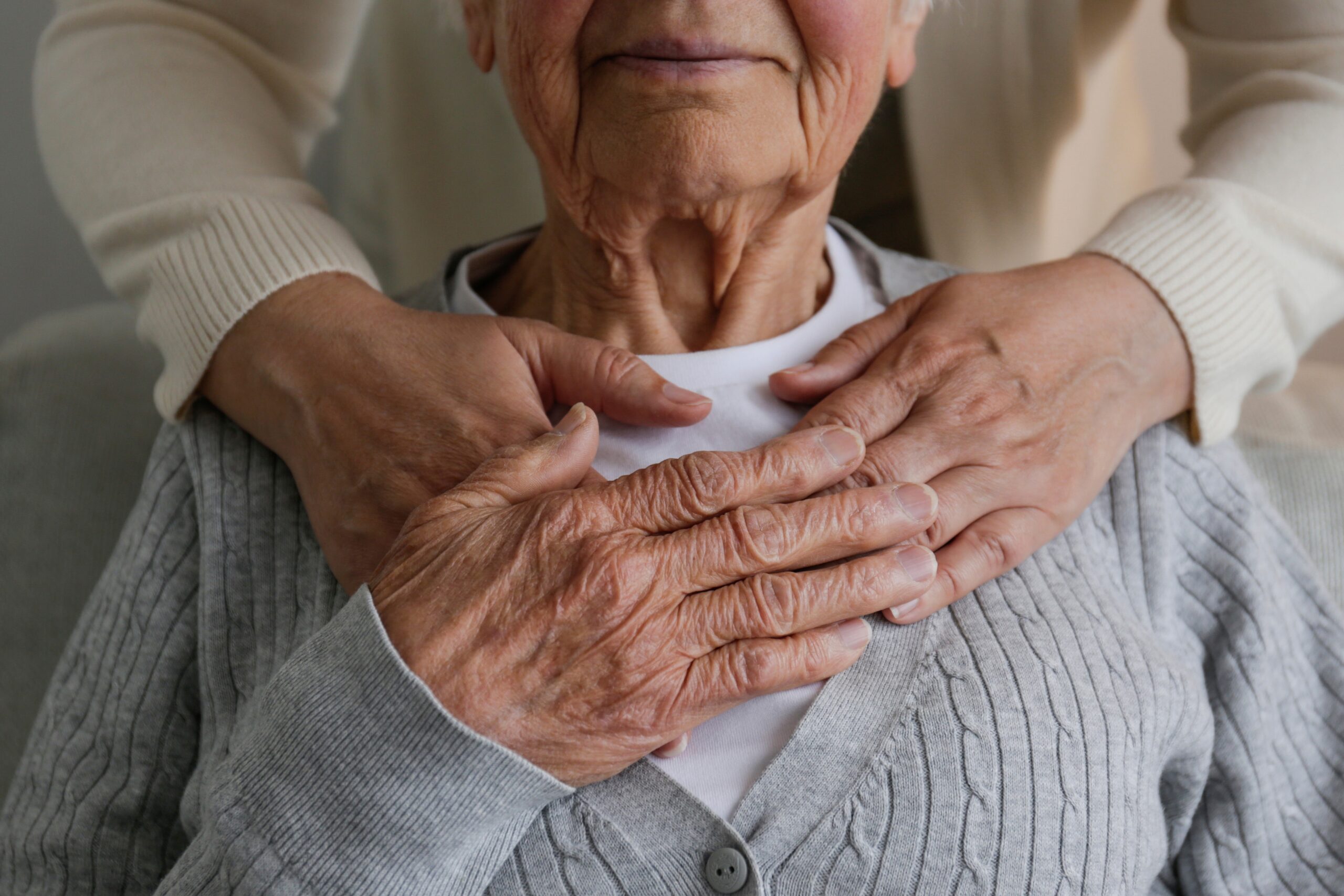 A care professional supporting an older adult