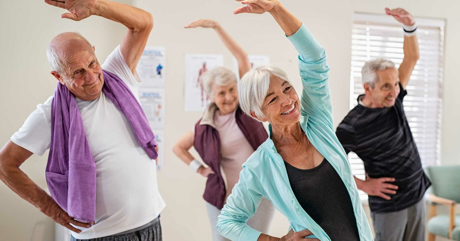 Senior citizens doing group exercises and stretches